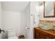 Modern powder room with glass vessel sink and wood vanity at 2981 Deer Point Dr, Seabrook Island, SC 29455