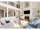 Two-story living room with a large sectional sofa, fireplace, and high ceilings at 2981 Deer Point Dr, Seabrook Island, SC 29455