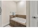 Small bathroom with shower/tub combo and tiled surround at 5559 Colonial Chatsworth Cir, North Charleston, SC 29418