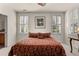 Bedroom with king-size bed and plantation shutters at 5559 Colonial Chatsworth Cir, North Charleston, SC 29418