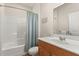 Bathroom with shower/tub combo, wood vanity and linen closet at 5559 Colonial Chatsworth Cir, North Charleston, SC 29418
