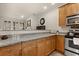 Kitchen with granite countertops and light wood cabinets at 5559 Colonial Chatsworth Cir, North Charleston, SC 29418
