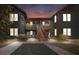Inviting exterior at night with warm lighting and landscaping at 5559 Colonial Chatsworth Cir, North Charleston, SC 29418