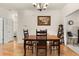 Bright dining room with hardwood floors and a wooden table at 5559 Colonial Chatsworth Cir, North Charleston, SC 29418