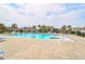 Inviting community pool with plenty of lounge chairs at 2712 Harmony Lake Dr, Johns Island, SC 29455
