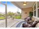Relaxing screened porch overlooking backyard patio and pond at 2712 Harmony Lake Dr, Johns Island, SC 29455