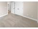 Spacious bedroom with neutral carpet and doors to bathroom and closet at 3699 Shutesbury St, Mount Pleasant, SC 29466