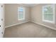 Bright bedroom with neutral colored carpet and two windows at 3699 Shutesbury St, Mount Pleasant, SC 29466