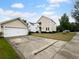 Two-car garage with driveway and well-maintained lawn at 3699 Shutesbury St, Mount Pleasant, SC 29466