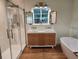 Modern bathroom with double vanity, soaking tub, and glass shower at 2407 Lantern St, Charleston, SC 29414