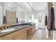 Elegant bathroom boasts dual vanities, a large mirror, and a walk-in shower at 3238 Plow Ground Rd, Johns Island, SC 29455