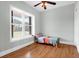 Small bedroom with a twin bed and large window overlooking the backyard at 3238 Plow Ground Rd, Johns Island, SC 29455