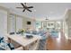 Bright living room with hardwood floors, comfortable seating, and large windows at 3238 Plow Ground Rd, Johns Island, SC 29455