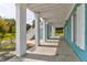 Covered porch with white columns and access to the backyard at 3238 Plow Ground Rd, Johns Island, SC 29455
