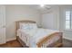 Cozy bedroom with wood bed frame and calming decor at 2395 Folly Rd # 4A, Folly Beach, SC 29439