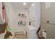 Laundry room with stackable washer and dryer, and storage shelves at 2395 Folly Rd # 4A, Folly Beach, SC 29439