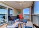 Screened balcony with wicker furniture and water views at 2395 Folly Rd # 4A, Folly Beach, SC 29439