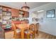 Dining area with built-in shelving and kitchen pass-through at 2395 Folly Rd # 4A, Folly Beach, SC 29439