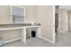 Bright laundry room with granite countertop and built-in cabinets at 301 Regatta Way, Summerville, SC 29486