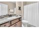 Bathroom with granite countertop, brown vanity, and shower at 301 Regatta Way, Summerville, SC 29486