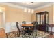 Charming dining room with round table and display cabinet at 586 Eastern Isle Ave, Summerville, SC 29486