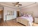 Spacious bedroom with large bed, dresser, and hardwood floors at 586 Eastern Isle Ave, Summerville, SC 29486