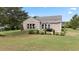 House back view, showcasing patio and landscaping at 586 Eastern Isle Ave, Summerville, SC 29486