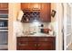 Convenient wet bar with granite countertop and wine storage at 586 Eastern Isle Ave, Summerville, SC 29486