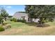 Back of house with patio and landscaping at 586 Eastern Isle Ave, Summerville, SC 29486