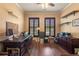 Bright home office features built-in shelving, wood desk, and large windows at 586 Eastern Isle Ave, Summerville, SC 29486
