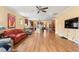Open concept living room with hardwood floors and kitchen access at 586 Eastern Isle Ave, Summerville, SC 29486