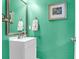 Small bathroom with mint green walls and white vanity at 2819 Pottinger Dr, Johns Island, SC 29455