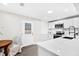 Modern kitchen with white cabinets, quartz countertops, and a convenient breakfast bar at 120 Blossom St, Goose Creek, SC 29445