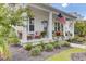 Spacious front porch with seating and potted plants at 661 Blueway Ave, Summerville, SC 29486