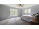 Spacious bedroom with large windows and grey carpet at 102 Swordgate Ct, Summerville, SC 29485