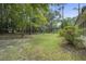 Large backyard with mature trees and green grass at 102 Swordgate Ct, Summerville, SC 29485