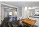 Bright dining area with hardwood floors and view into living room at 102 Swordgate Ct, Summerville, SC 29485