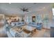 Open living room with light blue sofas, a rustic coffee table and hardwood floors at 3703 Hartnett Blvd, Isle of Palms, SC 29451