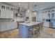 Modern kitchen with white cabinets, stainless steel appliances and a large island at 3703 Hartnett Blvd, Isle of Palms, SC 29451