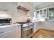 Bright kitchen, featuring stainless steel appliances and white shaker cabinets at 3703 Hartnett Blvd, Isle of Palms, SC 29451