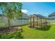 Convenient greenhouse in the backyard, ideal for gardening at 415 Watergrass Way, Summerville, SC 29485