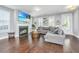 Living room with fireplace, hardwood floors, and plenty of natural light at 415 Watergrass Way, Summerville, SC 29485