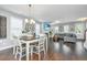 Open living and dining area with hardwood floors and fireplace at 415 Watergrass Way, Summerville, SC 29485