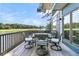 Deck with table and chairs overlooking golf course and lake at 4910 Green Dolphin Way, Kiawah Island, SC 29455