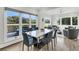 Modern dining area with marble table and chairs; golf course views at 4910 Green Dolphin Way, Kiawah Island, SC 29455