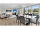 Modern dining area with marble table and chairs; golf course views at 4910 Green Dolphin Way, Kiawah Island, SC 29455