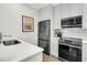 Modern kitchen with stainless steel appliances and white cabinetry at 4910 Green Dolphin Way, Kiawah Island, SC 29455