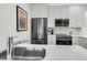 Modern kitchen with stainless steel appliances and white cabinetry at 4910 Green Dolphin Way, Kiawah Island, SC 29455