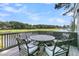Deck with table and chairs overlooking golf course and lake at 4910 Green Dolphin Way, Kiawah Island, SC 29455