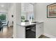 Compact kitchenette with dishwasher and view to dining area at 4910 Green Dolphin Way, Kiawah Island, SC 29455